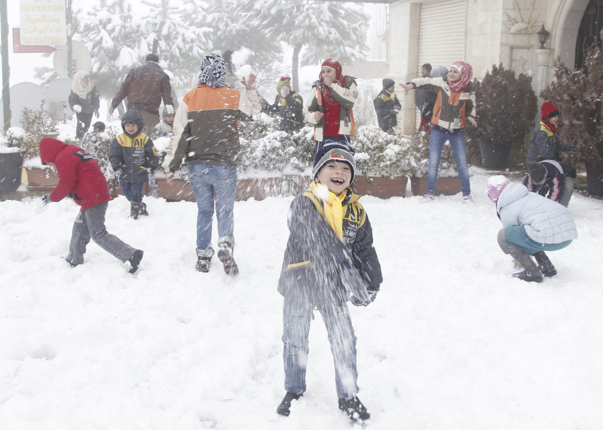 Children play with snow in Aley area, eastern Lebanon. (Mohamed Azakir /Reuters)